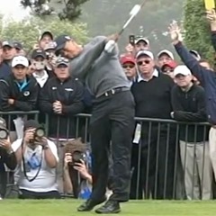 Tiger Woods’ follow-through, hands still in front of chest